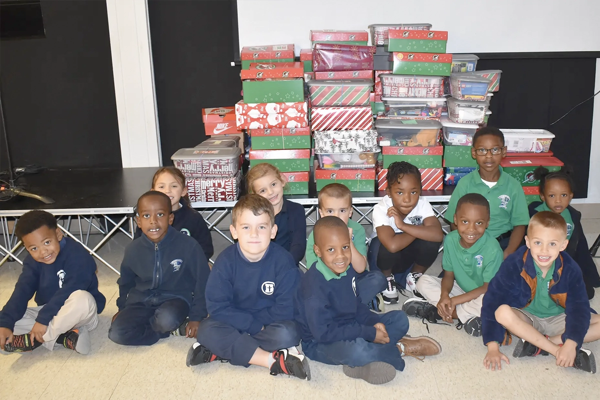 A group of Banner students pose with some of the shoeboxes filled by the Banner community.
